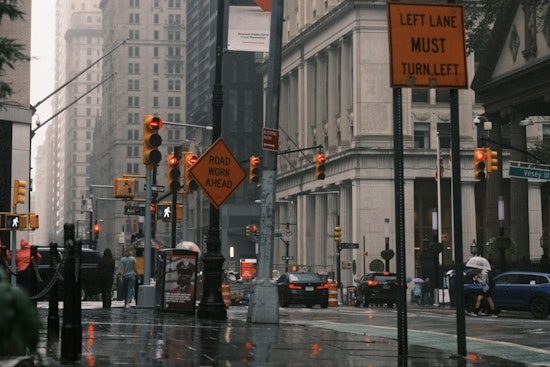 Umbrellas Up as New Yorkers Brace for Showers and Thunderstorms with Sunny Skies Expected by Midweek