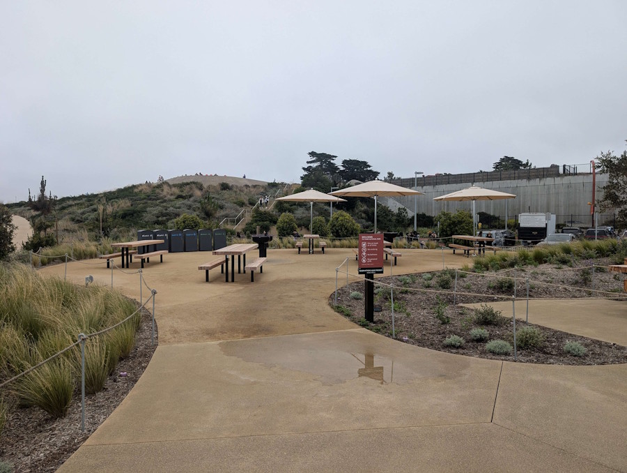 Reservable picnic area with grills and tables at Outpost Meadow