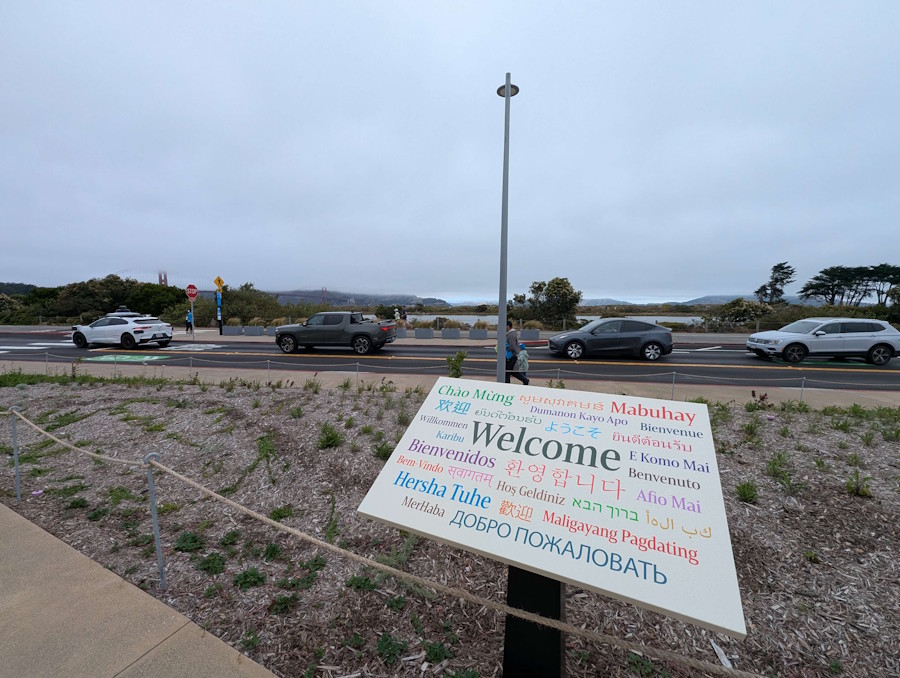 Welcome signage with Golden Gate Bridge visible in background