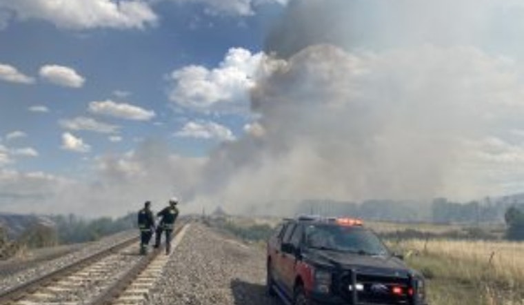 Airport Fire near Louviers Linked to Train Activities, Weather Aids Firefighting Efforts