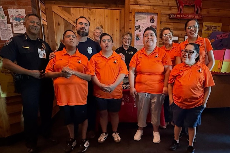Horizon City Police Trade Handcuffs for Aprons in Support of Special Olympics Texas at 'Tip-A-Cop' Event