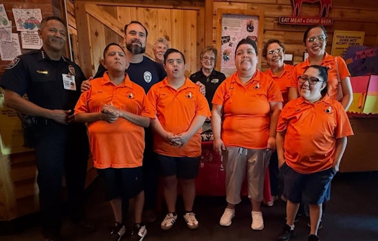 Horizon City Police Trade Handcuffs for Aprons in Support of Special Olympics Texas at 'Tip-A-Cop' Event