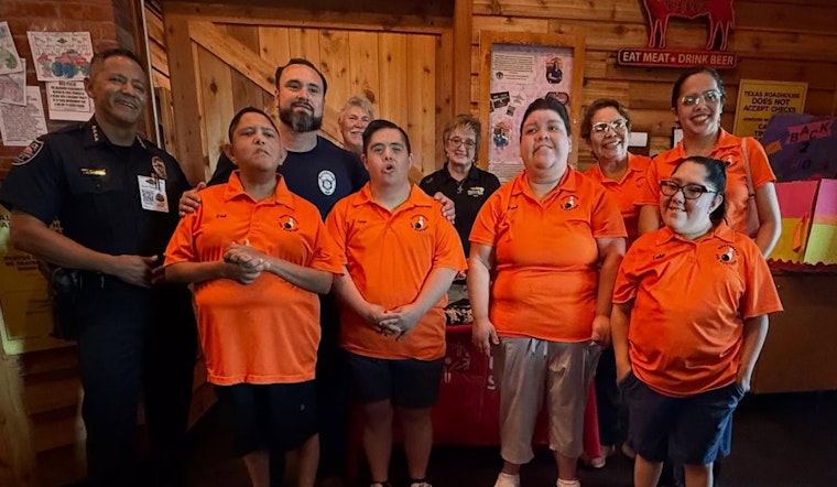 Horizon City Police Trade Handcuffs for Aprons in Support of Special Olympics Texas at 'Tip-A-Cop' Event