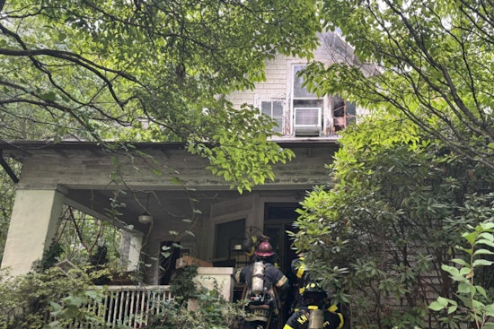 Knoxville Woman and Pet Dog Rescued from Blazing Home as Firefighters Overcome Obstacles