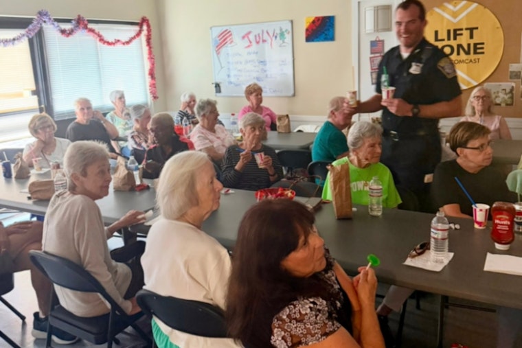 Boston Police Swap Handcuffs for Aprons, Serve Dinner at Senior Center Movie Night to Strengthen Community Bonds