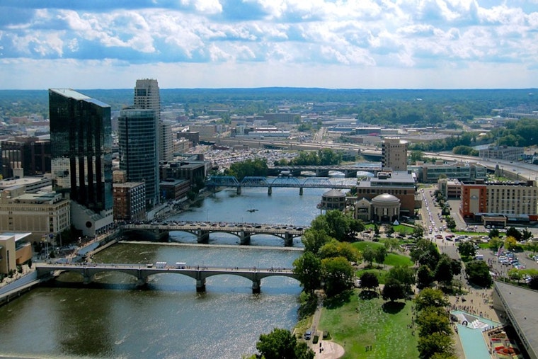 Grand Rapids Firefighters Conduct Unconventional Rescue of Drifting Porta-Potties on Grand River