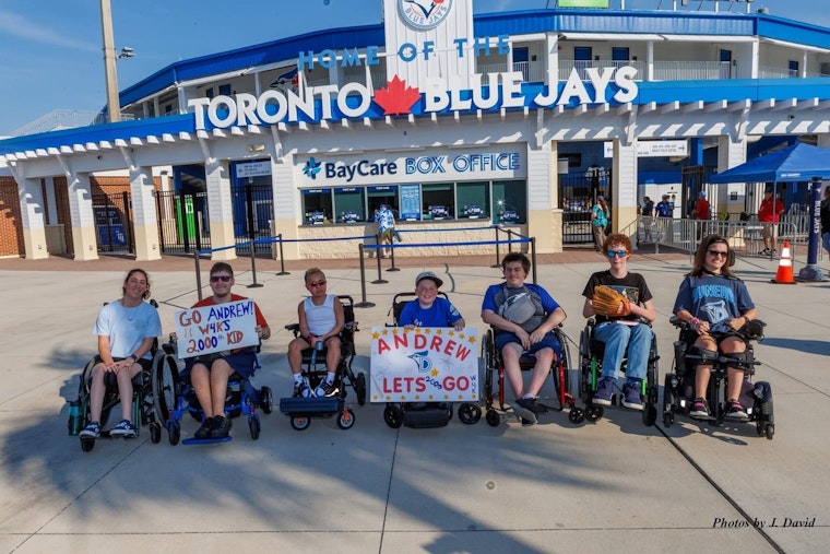 Dunedin Blue Jays Celebrate Wheelchairs4Kids' Milestone with First Pitch by Recipient of 2000th Wheelchair