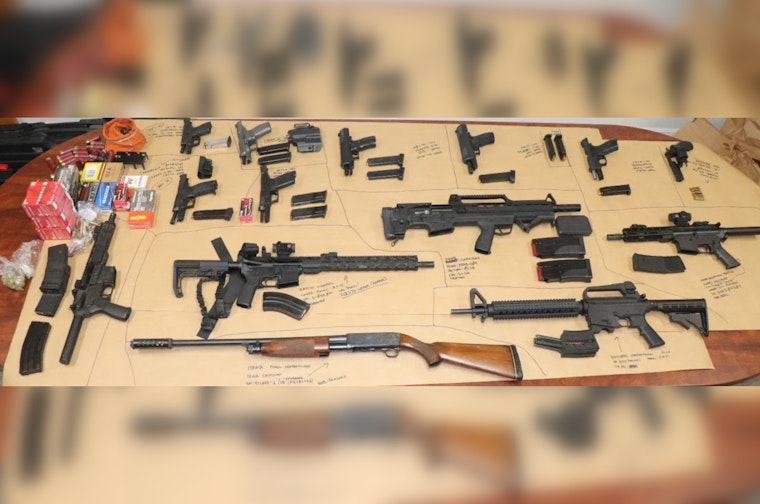 Riviera Beach Man Apprehended After Crashing Car and Brandishing Gun, 14 Firearms Seized
