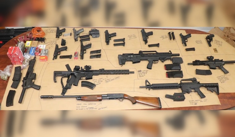Riviera Beach Man Apprehended After Crashing Car and Brandishing Gun, 14 Firearms Seized