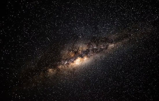 University of Cincinnati Physicist Explores the Dark Side of the Cosmos: Dark Matter and Energy Unveiled