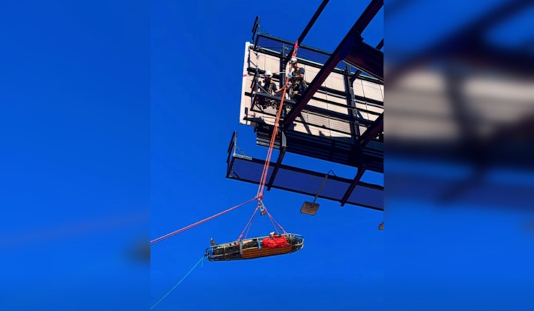 Oklahoma City Firefighters Execute Skilled Rescue of Worker atop Billboard
