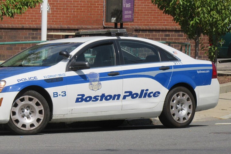 Boston Police Probe Shooting in Roxbury and Linked Dorchester Car Crash, Suspect At Large