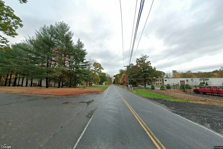 Car Crosses Tracks, Gully and Trees Before Slamming Into South Windsor Office