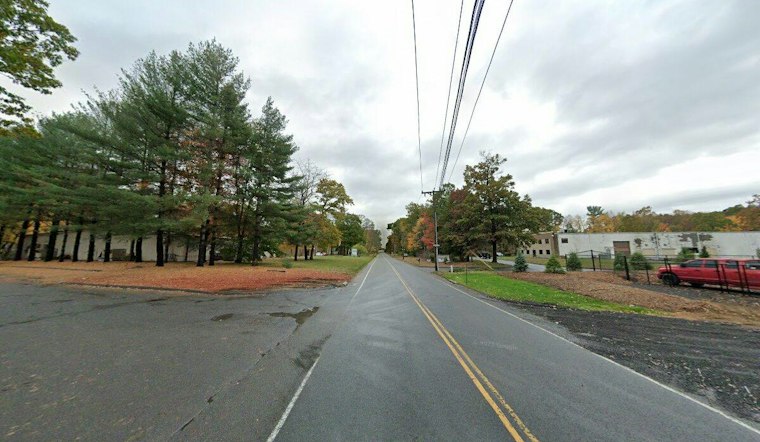 Car Crosses Tracks, Gully and Trees Before Slamming Into South Windsor Office