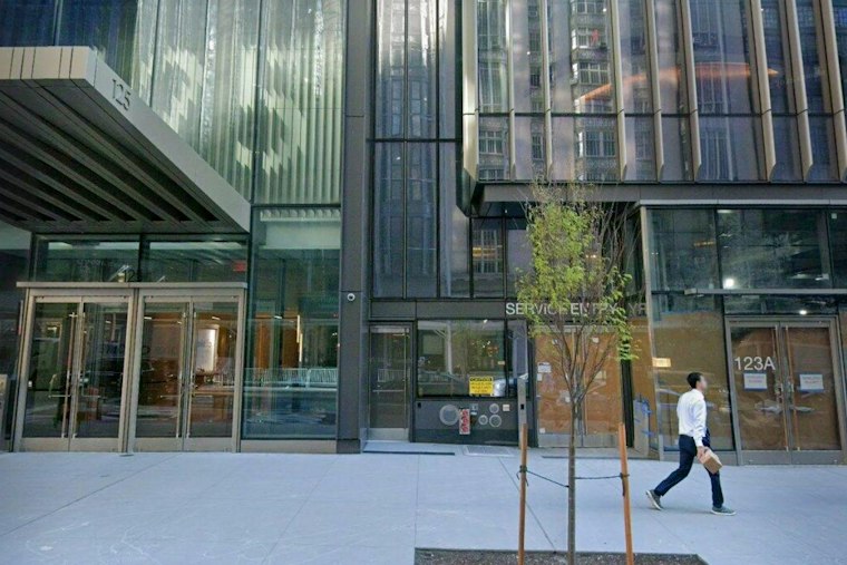 Car Flips Onto Its Side in Midtown, Three Hurt on West 57th Street