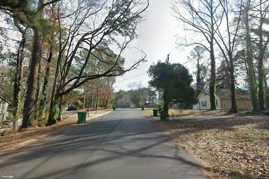 Gunfire Rips Through Timbers East Drive Homes in Lithonia, Wounding Two