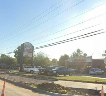 OKC Officer Hurt After Driver Slams Patrol Car, Crashes Into Little Caesar's
