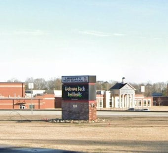 Parent's Tip Leads to Gun Found in Student's Car at Liberty High, Three Arrested