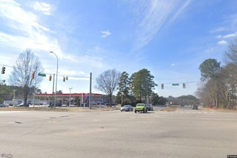 Red-Light Runner Slams Minivan Into Gas Station Sign on Capital Boulevard