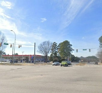 Red-Light Runner Slams Minivan Into Gas Station Sign on Capital Boulevard