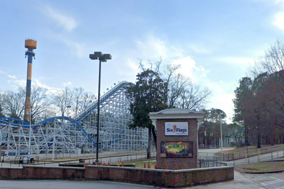 Riders Dangle on Six Flags Over Georgia's Goliath Coaster Mid-Track