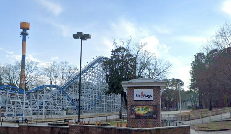 Riders Dangle on Six Flags Over Georgia's Goliath Coaster Mid-Track