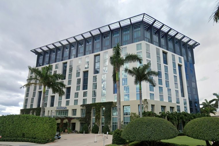 Student Reporter Sues Hilton West Palm Beach Over Bathroom Exposure at Boca Raton Bowl