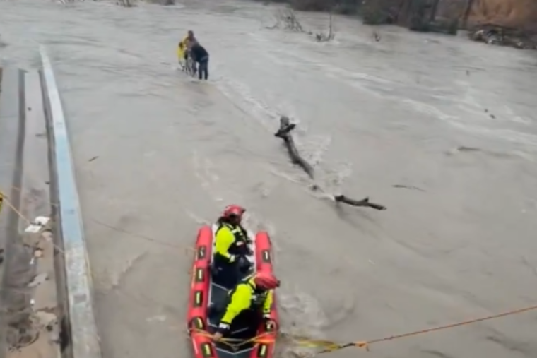 Dallas Fire Crew Hauls Two Men And A Bike From Cottonwood Creek Floodwaters