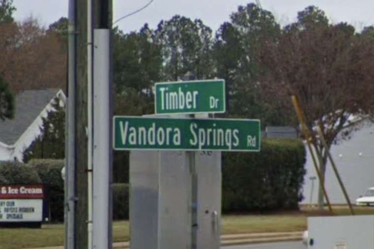 Driver Shot Behind The Wheel At Busy Garner Crossroads