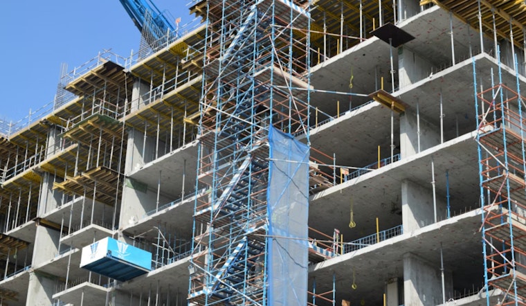 Jackson Ave Giant Muscles Into Court Square Skyline