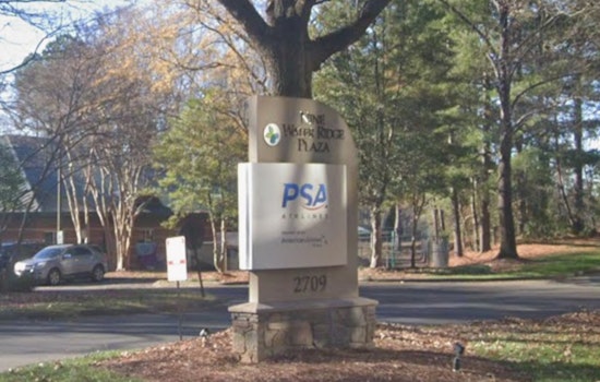 Stein Cuts Ribbon as PSA Jets Its HQ into Charlotte