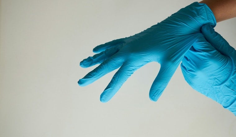 Glove Plant Bust Puts Minneapolis Colliers Office On The Hot Seat