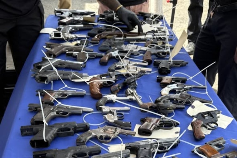 Oakland ‘Guns to Gardens’ Swap Turns War Weapons Into Gift Cards And Garden Tools