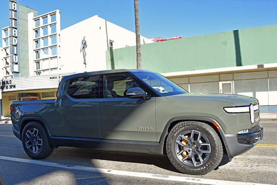 Fed-Up Denver Driver Plasters 'Don't Buy Junk' Warning On Rivian Outside Showroom