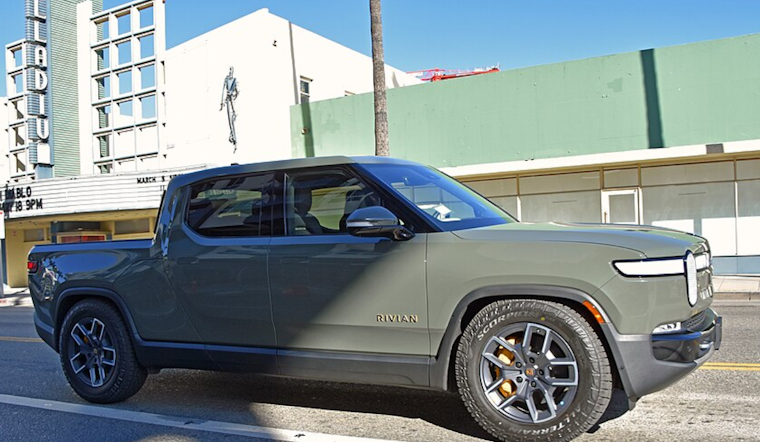 Fed-Up Denver Driver Plasters 'Don't Buy Junk' Warning On Rivian Outside Showroom