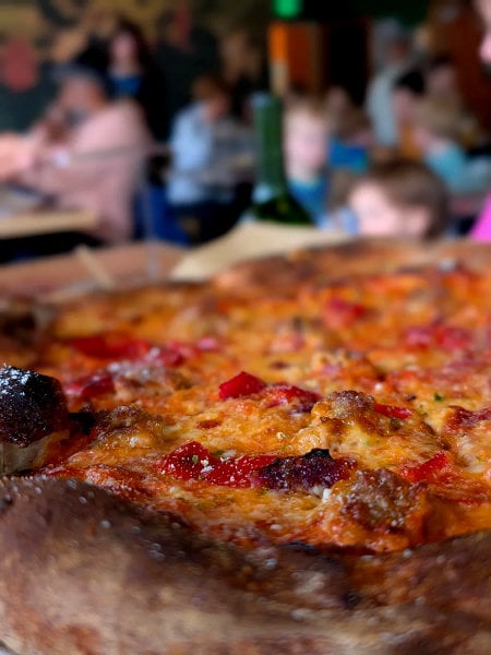 Old Faithful pizza at Rose Pizzeria with sausage and red peppers