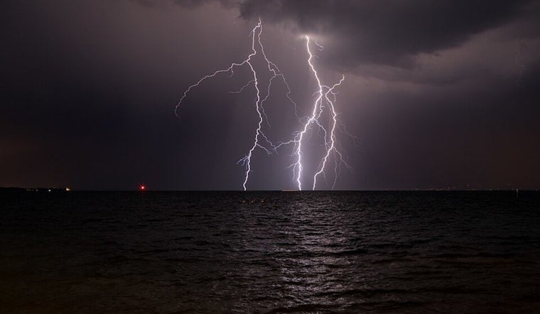 Storm Train Targets New Orleans as Streets and Seas Brace for a Soaking