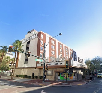 Downtown Gold Spike Cashes Out to Local Power Duo for $11.38 Million