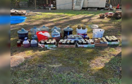 Faulty Blinker Leads Whiteville Cops To 18 Gallons Of Moonshine Stash