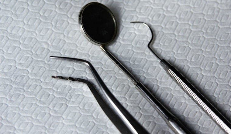 Oakbrook Terrace Dentist Left Patients Gorilla-Glues Smiles, Suits Say