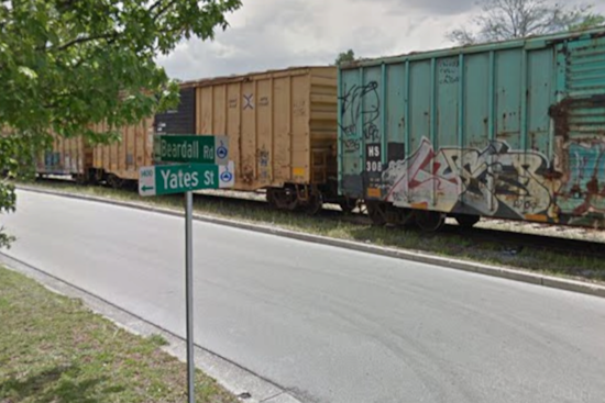 Freight Train Jumps Track, Leaves Leaning Boxcar In College Park