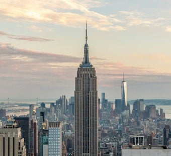 Masked Duo Scales Empire State Spire, Unfurls Peace Banner Over Midtown