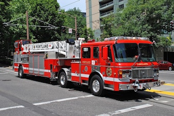Portland Firefighters Investigate Burning Debris Pile Near Structure