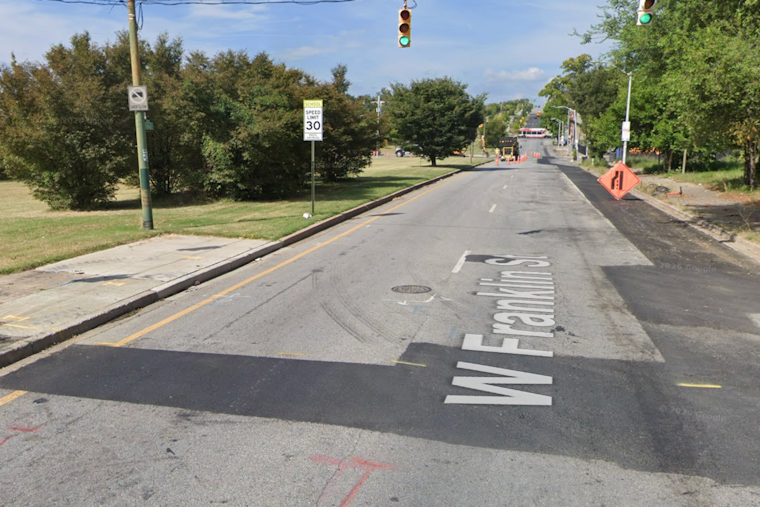 West Baltimore Street Turns Chaotic as Cop Shoots Amid Dog Attack
