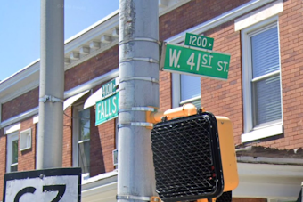 Hampden Carjacking: Woman Runs Over Man on Falls Road