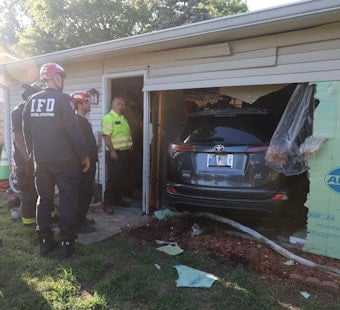 Indianapolis Driver Drives Through Home While Unloading Firewood