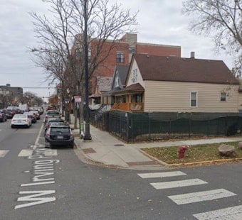Irving Park Corner Lot Trades Commercial Zoning for New Three-Flat Rentals
