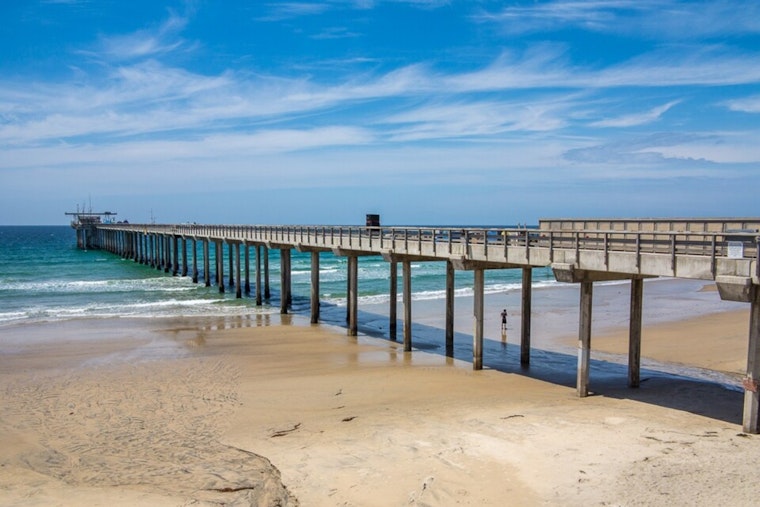 La Jolla Crowds Return for 'Scrippshenge' as Sun Splits Historic Pier's Pillars