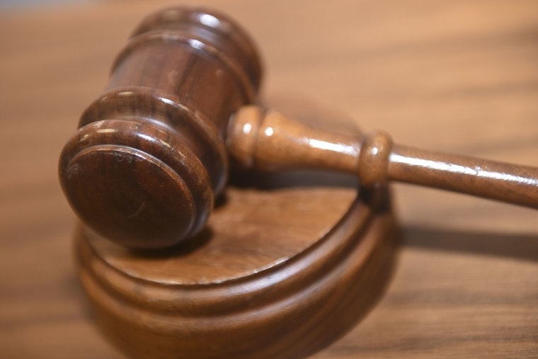 Milwaukee Boy, 11, Dies After Shooting Himself; Caretaker Now Charged and On the Run