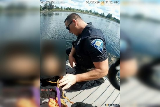 South Bend Officers Coax Autistic Child Off Riverside Dock Ledge